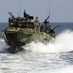 Sailors navigate the waters in a riverine command boat