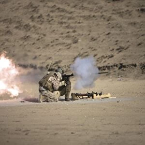 A soldier fires a rocket-propelled grenade launcher