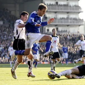 Fulham v Everton - 4 / 11 / 06 Franck Quedrue of Fulham slides in to tackle Evertons Phil Neville