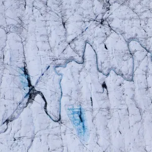 Aerial view of meltwater channels in ice cap north-east of Sermeq Kujalleq Glacier