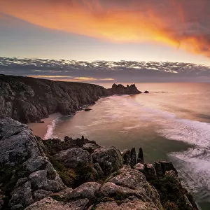 Logan Rock from Treen Cliff at sunearise, Porthcurno, Cornwall, England, UK. November