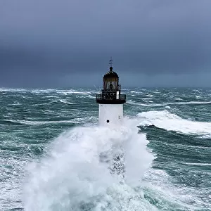 Rough seas at d'Ar-Men lighthouse during Storm 'Ruth', Ile de Sein, Armorique Regional Park. Iles du Ponant, Finistere, Brittany, France, Iroise Sea. 8th February 2014
