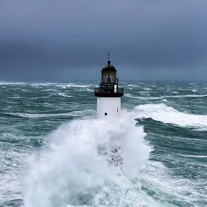 Rough seas at d'Ar-Men lighthouse during Storm Ruth, Ile de Sein, Armorique Regional Park. Iles du Ponant, Finistere, Brittany, France, Iroise Sea. 8th February 2014