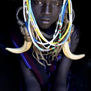 Young girl wearing traditional headdress, Mursi tribe, Mago National Park. Omo Valley