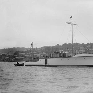 The 12 ton motor yacht Cordon Rouge at anchor, 1923. Creator: Kirk & Sons of Cowes