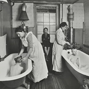 Attendants bathing boys at the Central Street Cleansing Station, London, 1914