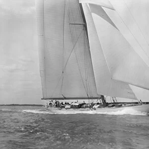 Deck of the 23-metre cutter Astra sailing close-hauled, 1933. Creator: Kirk & Sons of Cowes