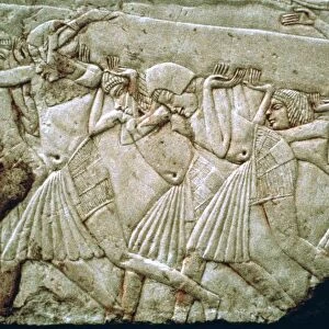 Egyptian relief of men moving a stone lintel