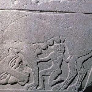 Etruscan grave-slab showing a man being suckled by a beast, 5th century