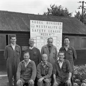 ICI powder works team in front of the Safety League board, Denaby Main, South Yorkshire, 1962