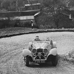 Jaguar SS 100 of CJ Gibson competing in the RAC Rally, 1939. Artist: Bill Brunell