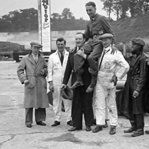 Leon Cushman being carried aloft after making a successful speed record attempt, Brooklands, 1931