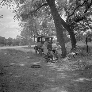 Migrant family from Oklahoma in Texas, alongside the road, 1936. Creator: Dorothea Lange