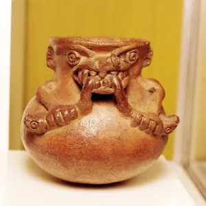 Pottery Bowl of an alligator with human arms devouring snakes, Chiriqui, Panama