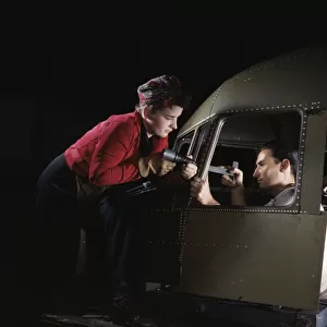 Riveting team working on the cockpit shell of a... Douglas Aircraft Co. Long Beach, Calif. 1942. Creator: Alfred T Palmer