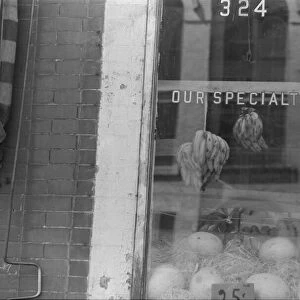 A shop window, 61st Street between 1st and 3rd Avenues, New York, 1938. Creator: Walker Evans