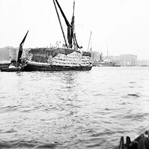 Topsail barge on the Thames with its top mast lowered, London, c1905