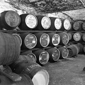 Whisky in barrels at a bonded warehouse, Sheffield, South Yorkshire, 1960. Artist