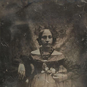 Young woman holding a flower, ca. 1842. Creator: Joseph Philibert Girault De Prangey