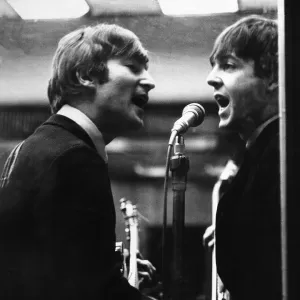 John Lennon and Paul McCartney in a recording studio