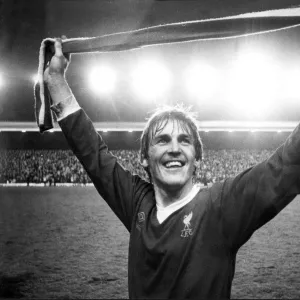 Kenny Dalglish salutes the Kop after Liverpool clinched the league