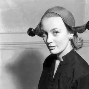 Model wearing jester style hat 1955