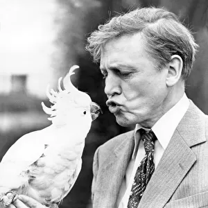 Sir David Attenborough with a cockatoo