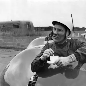 Stirling Moss has a cup of tea