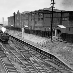 Train passing Manchester United Football Ground, 1935