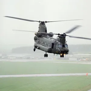 A Chinook of 27 Sqn based at RAF Odiham photographed flying low over an airfield in Scotland