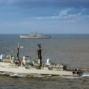 HMS Exeter is shown in the foreground with HMS Illustrious, taking part in Exercise Neptune Warrior