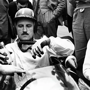 1962 Dutch Grand Prix. Zandvoort, Holland. 18-20 May 1962. Graham Hill (BRM P57), 1st position, recieves a drink in parc ferme, portrait. World Copyright: LAT Photographic Ref: 10151