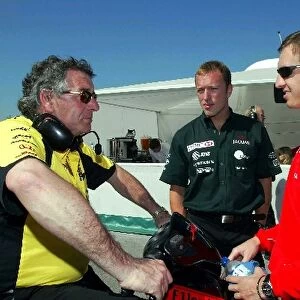 Formula One Testing: Gary Anderson Jordan Chief Engineer chats with Ferrari test driver Luciano Burti watched by Nick Harris, Jaguar