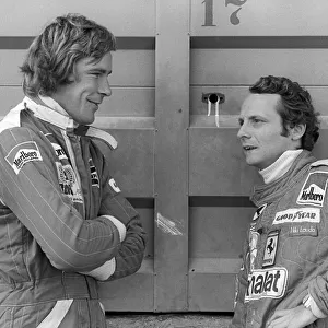 Formula One World Championship: Second placed James Hunt McLaren, talks with race winner Niki Lauda Ferrari