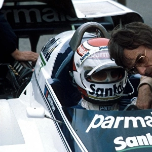 Sutton Motorsport Images Catalogue: Nelson Piquet Brabham BT50 talks with Brabham team owner Bernie Ecclestone