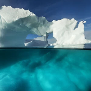 Antarctica, Underwater View Of Arched Iceberg Floating Near Enterprise Island On Sunny Spring Morning Along Antarctic Peninsula