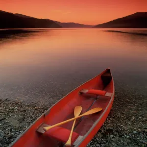 Canoe At Edge Of Mountain Lake, Shuswap, British Columbia, Canada