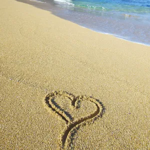 A Heart Shape Drawn In The Sand On Tunnels Beach; Kauai, Hawaii, United States Of America