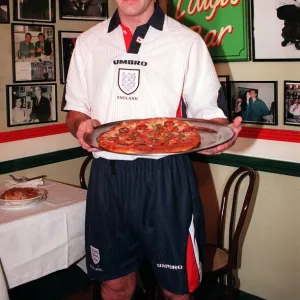 12 - ALAN SHEARER SHOWING OFF THE NEW 1997 ENGLAND KIT HOLDING A PIZZA