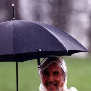 Actor Christopher Lee well protected from the weather during filming of Ivanhoe for