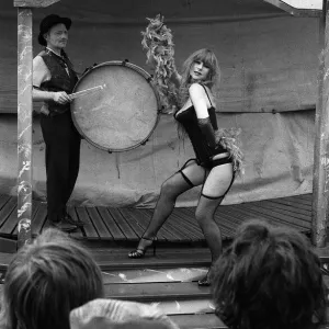 Actress Helen Mirren wearing a fishnet tights portraying character of fairground stripper