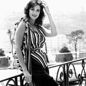 Actress Lynda Carter in July 1983, relaxing against a balcony during her stay in Monte