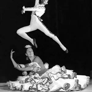 Alberto Portillo leading male dancer of the ballet leaps over dancer Nana Lorca during