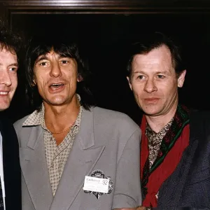 Alex Higgins poses with fellow snooker player Jimmy White and Ronnie Wood