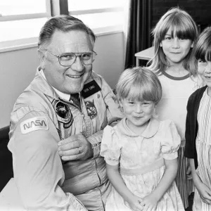 All smiles as these three Huddersfield youngsters come face-to-face with a real spaceman