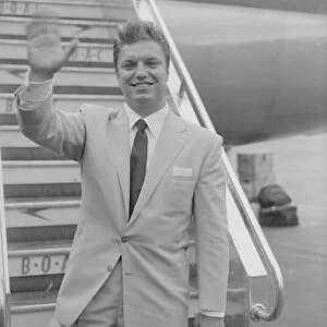 American singer Guy Mitchell seen here arriving at London, Heathrow Airport