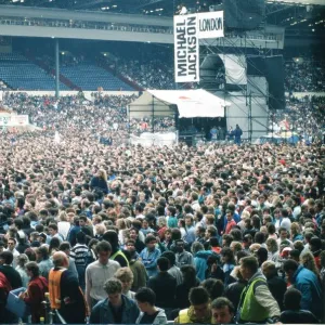 Audience gather outside the Wembley arena prior to the Michael Jackson concert