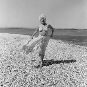 Barbara Windsor, Actress, 7th July 1976. Pictured, taking a break from an unusual role