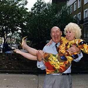Bernard Bresslaw Actor holding actress Barbara Windsor in his arms