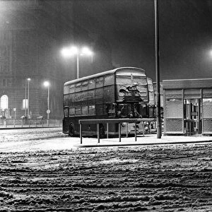 The bleak scene at the Pier Head as the snow gets a grip. Liverpool, Merseyside